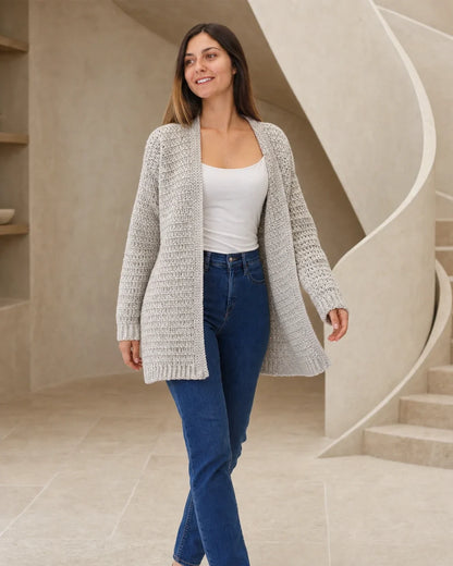 Grey lightweight crochet cardigan styled in a bright interior.
