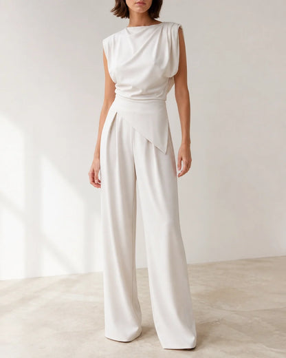 Women's white asymmetric draped top and wide-leg trousers set, product-first view.