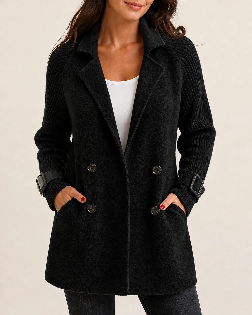 Black mid-length coat with knit sleeves worn, color view.