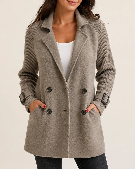 Taupe mid-length coat with knit sleeves worn, product hero.