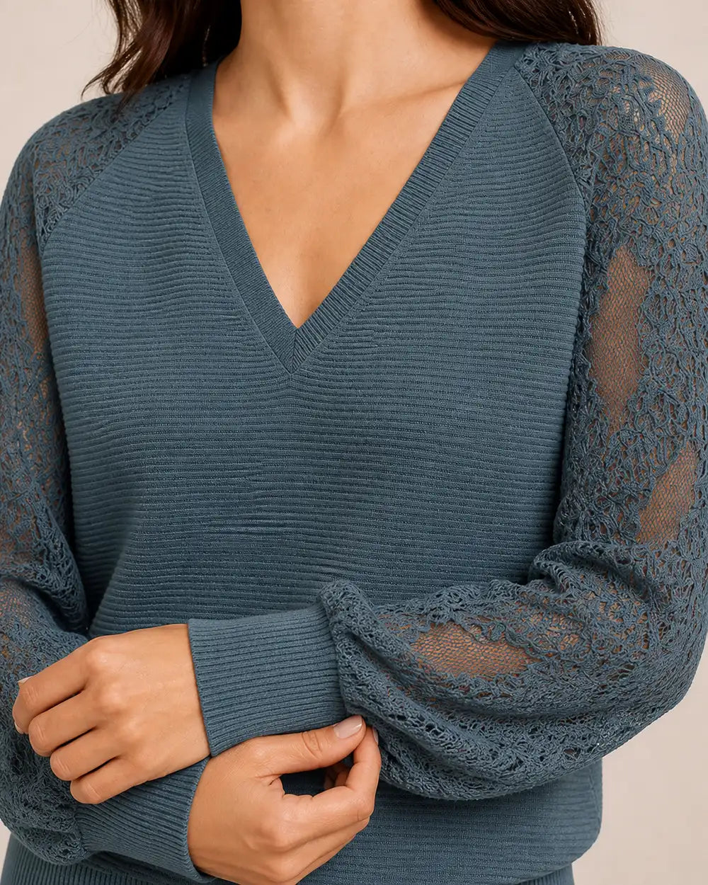 Women's Storm Blue ribbed V-neck sweater, close view of V-neck ribbing and floral lace sleeves.