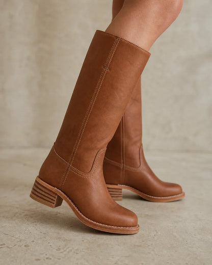 Brown round-toe knee-high boots, stitching and stacked heel detail